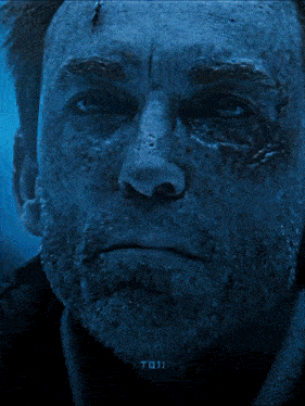 a close up of a man 's face with the words " do it " on the bottom