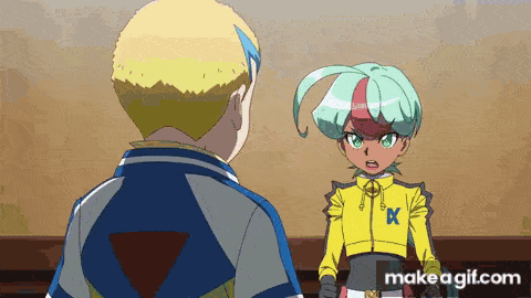 a man and a girl are standing next to each other in a room .