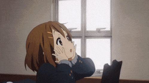 a girl with a surprised look on her face is looking out a window .