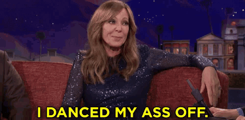 a woman is sitting on a couch and saying i danced my ass off .