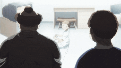 a boy playing a video game while two men watch