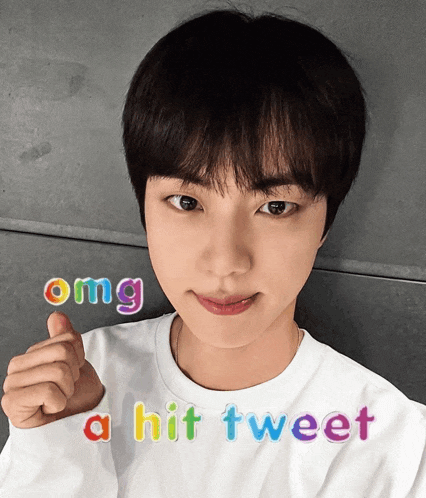 a young man giving a thumbs up with the words omg a hit tweet behind him