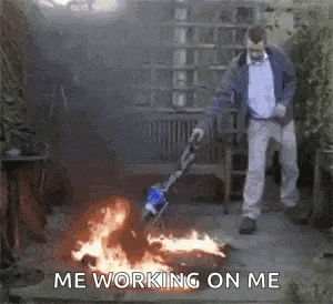 a man is using a vacuum cleaner to clean a fire .