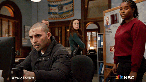 a man is holding a gun in front of a computer screen with the hashtag #chicagopd on it
