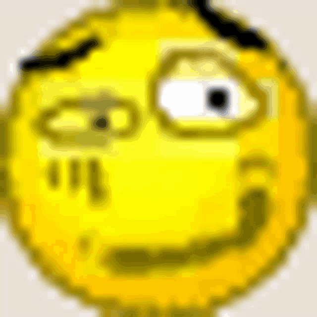 a close up of a pixelated smiley face with a slight smile on its face .
