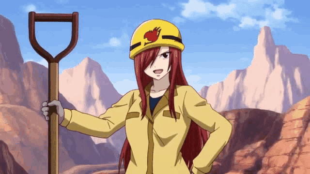 a girl with red hair is wearing a yellow hard hat