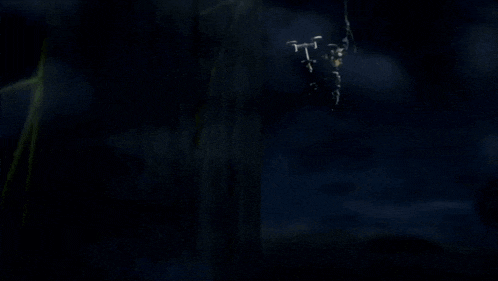 a blurred image of a robot with a green light coming out of its mouth