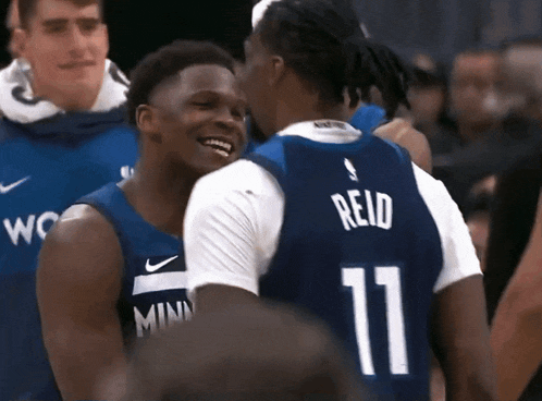 two basketball players one with the number 11 on his jersey