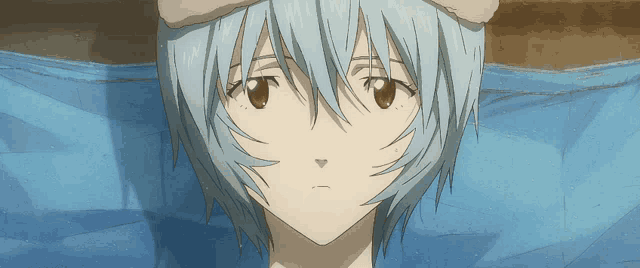 a close up of a girl with blue hair