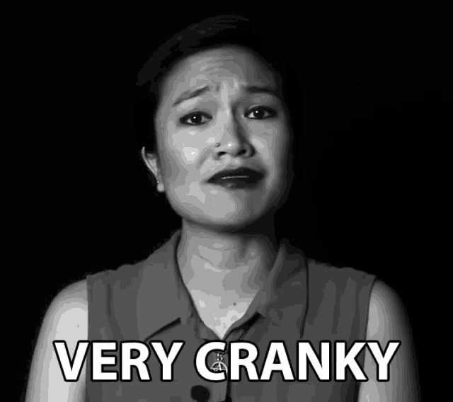 a black and white photo of a woman with the words very cranky behind her