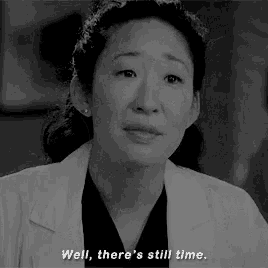 a black and white photo of a woman in a lab coat saying well , there 's still time .