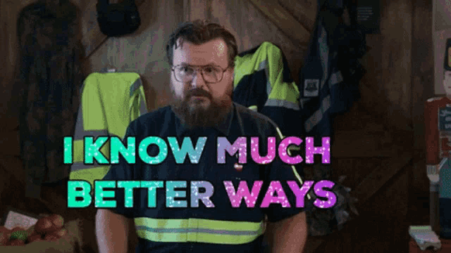 a man with a beard and glasses is standing in front of a sign that says i know much better ways