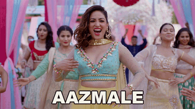 a group of women are dancing and the word aazmale is above them