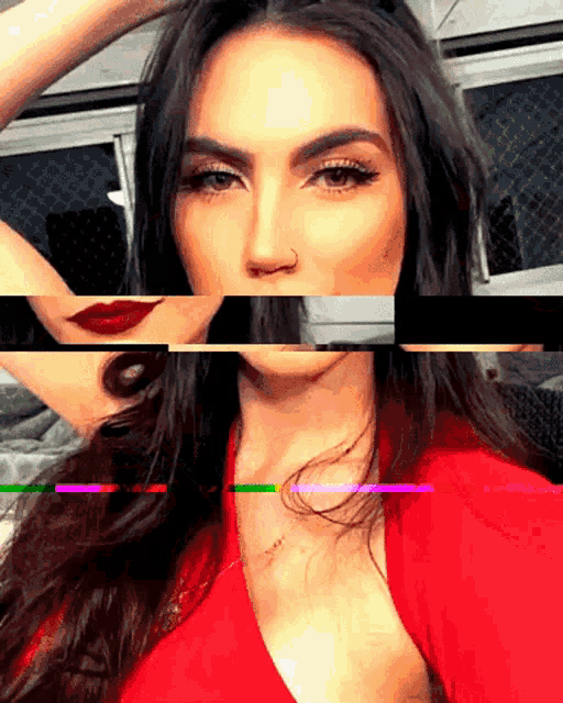 a woman in a red top has a nose ring on