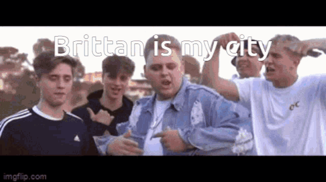 a group of young men are standing next to each other and one of them says brittan is my city