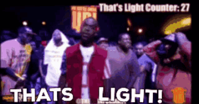 a group of men are standing in front of a sign that says that 's light