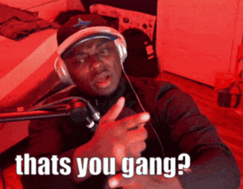 a man wearing headphones and a hat with the words thats you gang