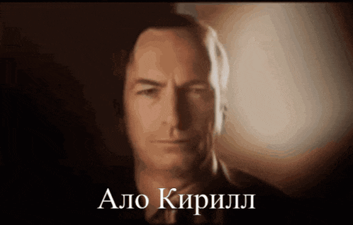 a close up of a man 's face with the name alo written on the bottom right