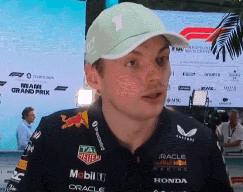 a man wearing a hat and a shirt that says mobil 1