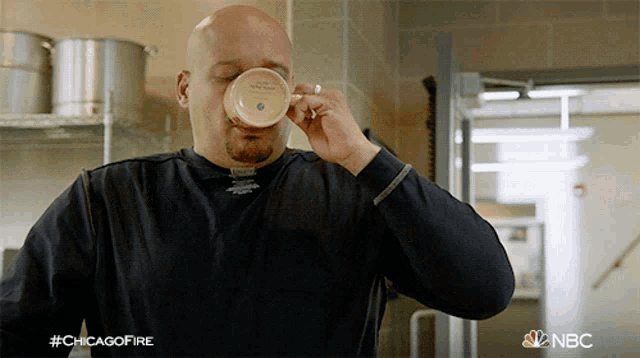 a man is drinking from a cup with the hashtag #chicagofire