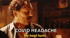 a man with a mustache is talking about a headache and saying `` covid headache my head hurts '' .