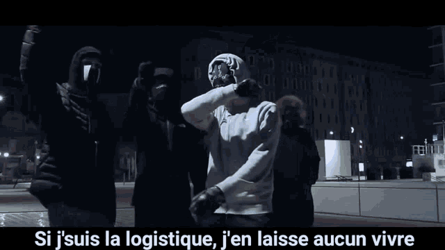 a man in a white hoodie is pointing a gun at another man