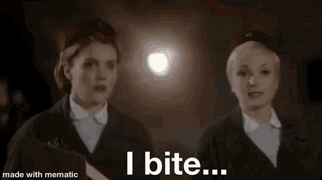 a woman is standing in front of a man and says `` i bite '' .