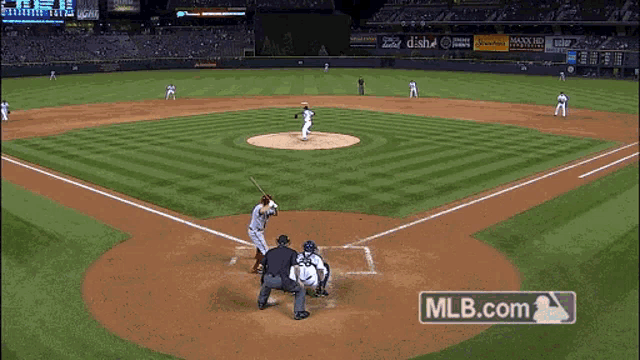 a baseball game is being played in a stadium with mlb.com on the bottom of the screen