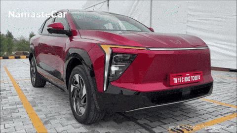 a red car with a license plate that says tn 10 c 0002 tc 007t4