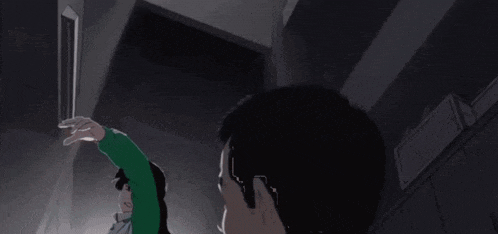 a close up of a person 's face with a green and white shirt on