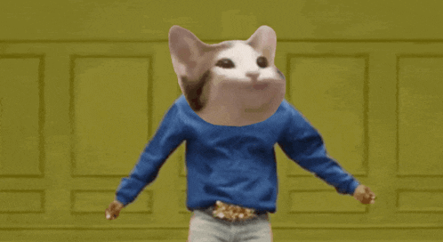 a cat wearing a blue shirt with its mouth open