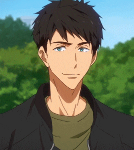a man with brown hair and blue eyes is wearing a black jacket .