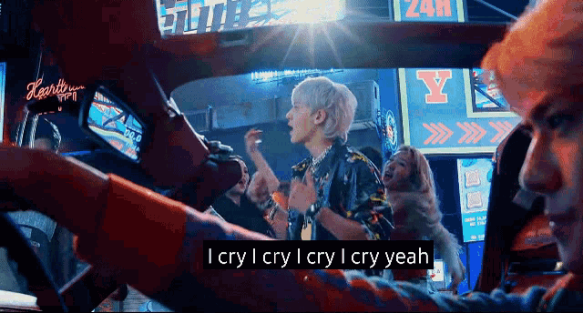 a man singing in a car with the words i cry i cry i cry yeah on the bottom