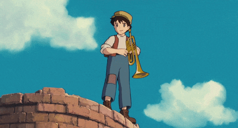 a boy playing a trumpet surrounded by white birds