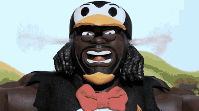 a cartoon character with a penguin hat and a bow tie