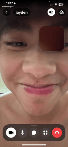 a phone screen shows a video call with jayden on it