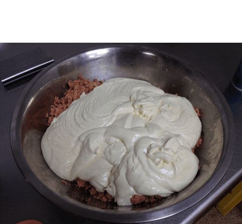 a bowl filled with a thick creamy substance that looks like a face