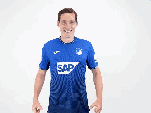 a man wearing a blue shirt that says sap