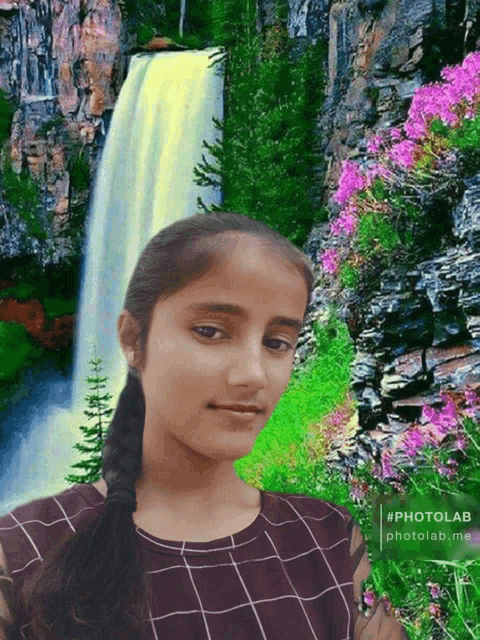 a girl is standing in front of a waterfall with a photolab watermark