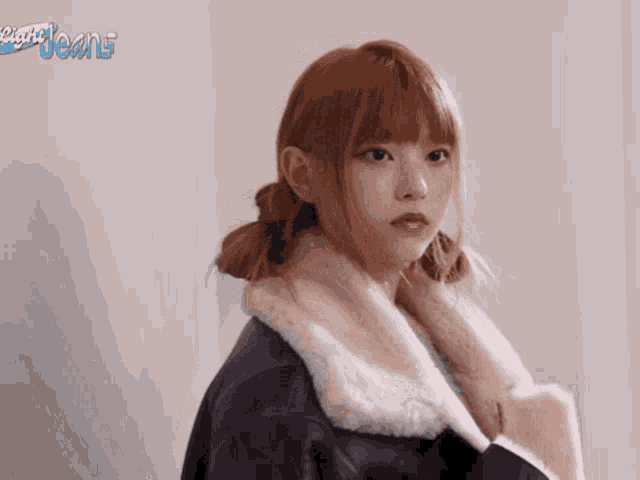 a girl with red hair is wearing a fur coat and looking at the camera