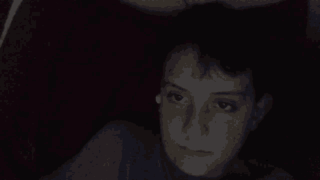 a young boy making a scary face with his mouth open
