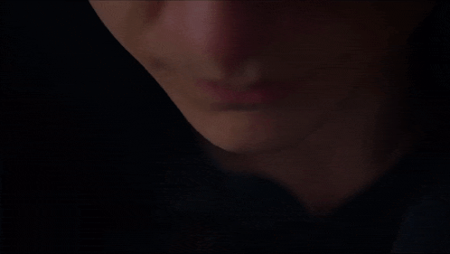 a close up of a person 's face with the word igowalla in white letters
