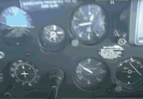a close up of a dashboard with a few clocks and a sign that says managing personnel for all