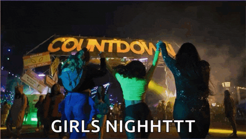 a group of girls dancing in front of a sign that says countdown girls nighttt