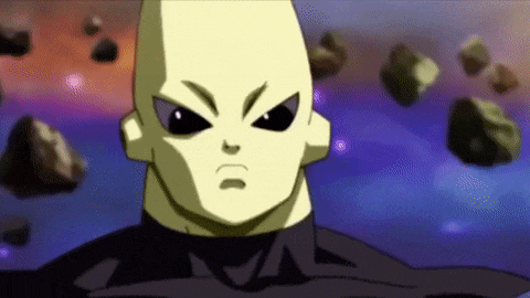a close up of a cartoon character 's face with a purple background and rocks flying in the background .