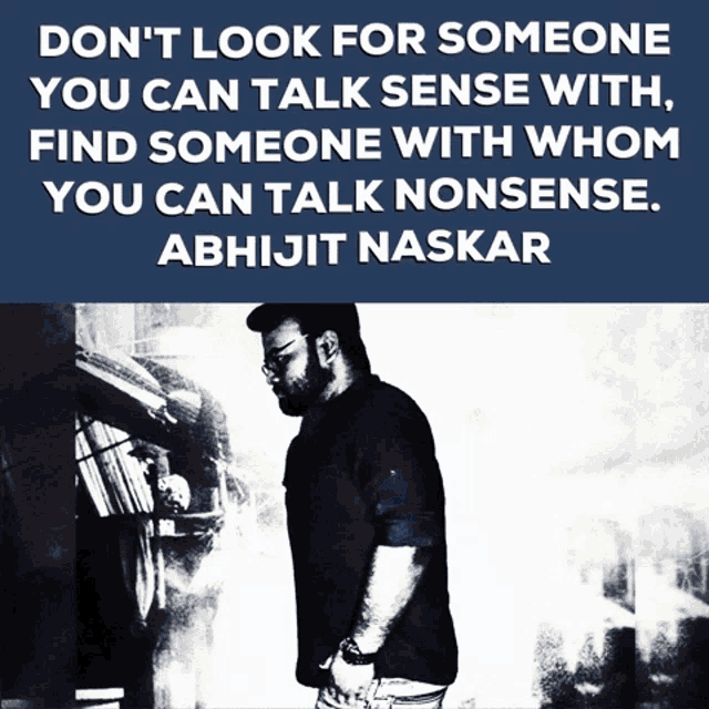 a man is standing in front of a bookshelf with a quote by abhijit naskar