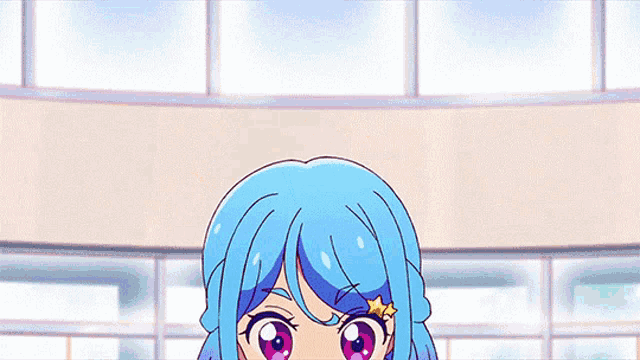 a girl with blue hair and a star on her head is standing in front of a window .