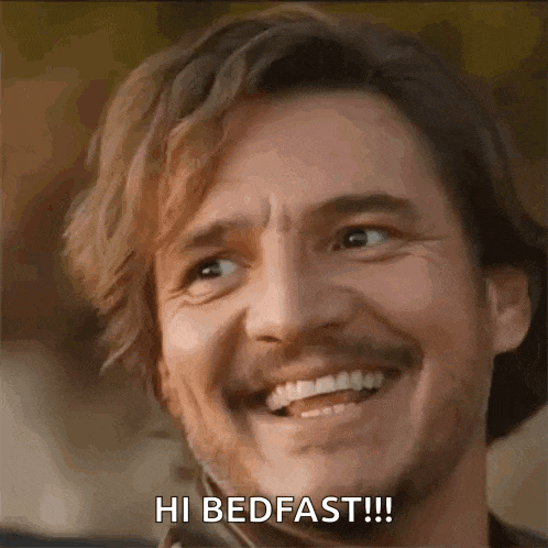 a man with a beard is smiling and says `` hi bedfast '' .