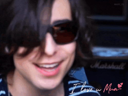 a close up of a person wearing sunglasses with the words " i love u mary " below them