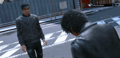 two men are standing on a street with a deflection master badge